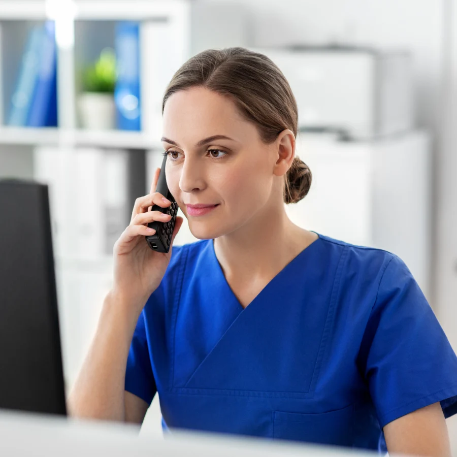 A licensed physician on a phone call with a patient